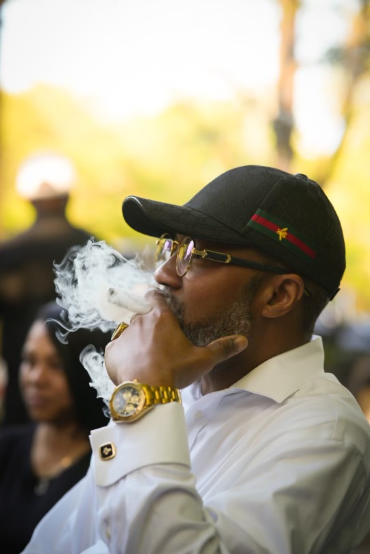 A guest enjoying a cigar at a Velvet Leaf event